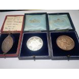 An "Exeter modern school" boxed silver medal and two Newport school medals (3)
