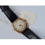 A gents wrist watch with engraved back in 9ct