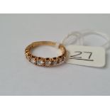 A DIAMOND HALF HOOP RING IN 18CT GOLD - size K