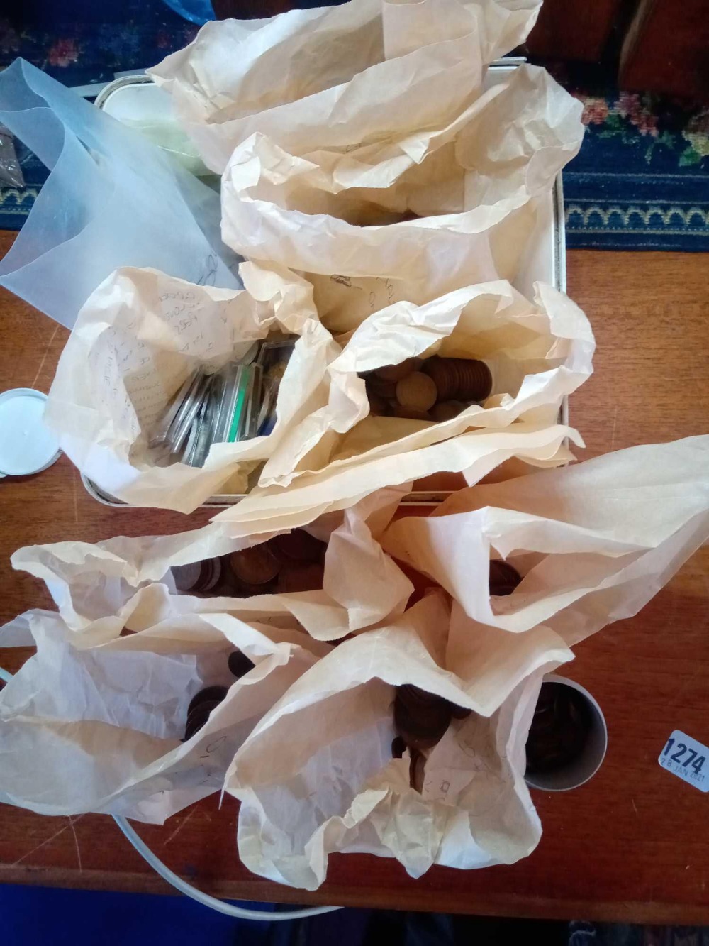 A tub of coins in bags