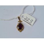 A garnet drop pendant in 9ct