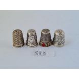 Four silver thimbles