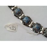 An attractive bracelet with matrix turquoise & coloured stoned