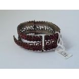 A large garnet bangle - a/f