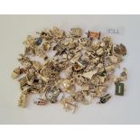 A large quantity of silver charms - 326gms