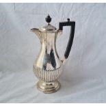 A half fluted coffee jug 10 1/2 inches high Sheffield 1921 by the goldsmiths Co 462 gms