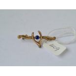 A wishbone bar brooch with single single blue stone