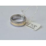 A pair of titanium / 9ct gold rings 13gms