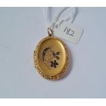 A back & front oval locket in 9ct - 7.1gms