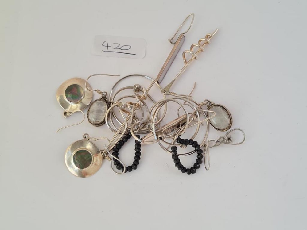Seven pairs of assorted silver earrings