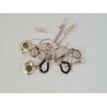 Seven pairs of assorted silver earrings
