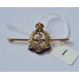 A gold & regimental 'IN ARDUIS FIDELIS' brooch in 15ct gold - 5gms