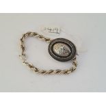 A silver rope twist bracelet & Victorian brooch