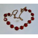 A Georgian red paste necklace set in yellow metal