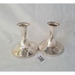 A pair of candle sticks of contemporary design 3 inches high B'ham 1974