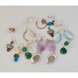 Eight pairs of silver earrings