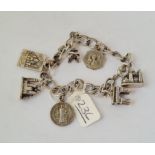 A silver charm bracelet - 30.7gms