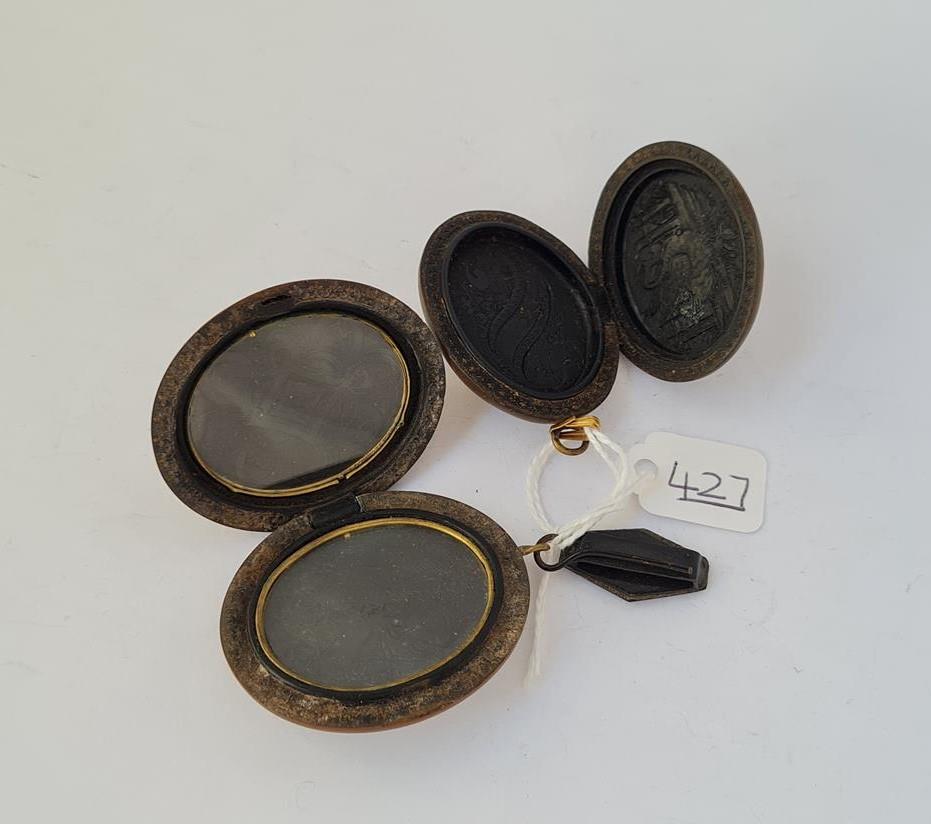 Two vulcanite cameo lockets