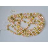 A fancy coloured fresh water pearl necklace of opera length - 60" long