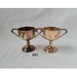 A pair of plain 2 handled trophy cups 3 inches high B'ham 1932 117 gms