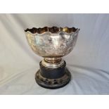 A good Rose bowl with shaped moulded rim 10 inches wide London 1914 by HR&Co 1000 gms excluding wood