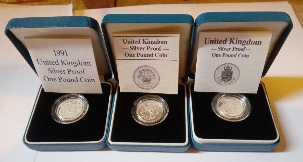 A 1986 1988 & 1991 silver proof £1 coins all with COA