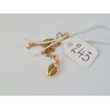 A gold coffee bean pendant necklace