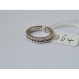 A DIAMOND ETERNITY RING SET IN PLATINUM - 0.9cts - size J - 6.5gms