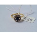 A sapphire & diamond cluster ring in 18ct gold - size O - 4.1gms