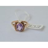 A vintage amethyst ring in 9ct - full hallmarks - size O - 3gms