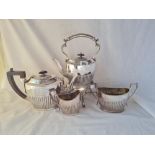 A oval half fluted tea set with kettle on stand