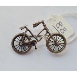 An unusual silver brooch in the form of a bicycle