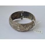 A white metal bangle