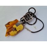 A giant silver & amber pendant