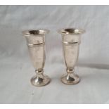 A pair of vases with spreading bases 3 1/2 inches high 84 gms