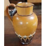 A Doulton jug with scroll handle - 9" high