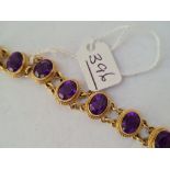 A good amethyst 11 panel bracelet in 9ct - 19.2gms