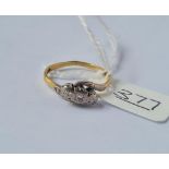 A 3 stone diamond ring in 18ct gold - size M.5 - 2.8gms