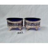 A pair of oval boat shaped salts on scroll feet Sheffield 1907 by TL 64 gms excluding BGL