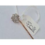 An attractive gold stick pin set with a diamond cluster set in platinum - middle stone 2mm