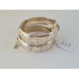 Two engraved wide silver bangles