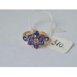 A good quality tanzanite & diamond cluster ring in 9ct - 8 tanzanite's with central diamond - size N