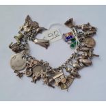 A silver charm bracelet - 65gms