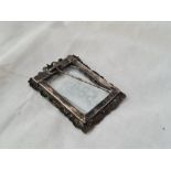 A small Chinese photo frame with dragon boarder 2 1/4 inches high