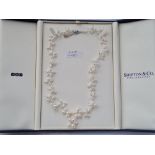 A boxed pearl necklace with silver clasp