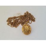 Two metal gilt guard chain & a circular locket