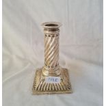 A Victorian square base candle stick with fluted decoration 5 inches high London 1885 by Martin hall