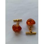 A pair of amber gilt cufflinks