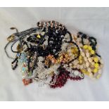 A bag of assorted costume jewellery