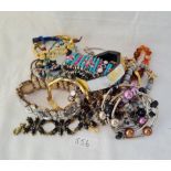 A bag of assorted costume jewellery